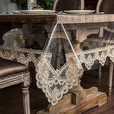 the table is covered with white lace