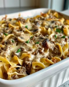 a casserole dish filled with pasta and meat