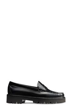 A thick lug sole grounds this glossy leather loafer that features a moc toe and sculpted penny slot. 1 1/4" heel Cushioned insole Leather upper and lining/rubber sole Imported Classic Moc Toe Oxfords With Lug Sole, Classic Oxfords With Lug Sole And Moc Toe, Classic Black Platform Loafers With Vibram Sole, Classic Black Platform Loafers With Moc Toe, Classic Black Moc Toe Platform Loafers, Classic Moc Toe Loafers With Vibram Sole, Classic Patent Leather Platform Loafers With Lug Sole, Classic Moc Toe Platform Loafers For Fall, Classic Patent Leather Platform Loafers With Rubber Sole