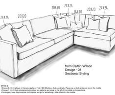 a drawing of a sectional couch with pillows on the top and bottom corner, as well as