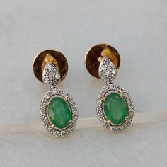 ▶️ This earrings made with natural emerald diamonds in solid 18k yellow gold,▶️ Pave Diamond Gemstone Stud Earrings, Solid 18k Yellow Gold Fine Jewelry.▶️ Gemstone Earrings, Diamond Earrings, Stud Earrings, Everyday Jewelry▶️ Special customize for Mother's day, Anniversary, Birthday Gift, Valentine, Christmas. ▶️ Item Details:18k Yellow Gold Weight:3.08 GramsDiamond Weight:0.22 CaratsGemstone:Natural EmeraldsStud Size: 14.52 x 7.18 mmItem SKU: CDFJE-0163Gemstone color may vary due to natural and Oval Diamond Bridal Earrings For Anniversary, Classic Round Hand Set Earrings, Formal Gemstone Bridal Earrings, Round Shape, Formal Round Gemstone Bridal Earrings, Oval Diamond Earrings Hand Set, Emerald Earrings With Diamond Accents, Exquisite Oval Diamond Earrings For Anniversary, Oval Bridal Earrings For Anniversary In Fine Jewelry Style, Oval Halo Design Bridal Earrings For Formal Occasions