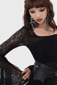 ROSEDRIAH BODYSUIT.- Statement custom lace.- Long bell sleeves.- Square neckline.- Keyhole button closure.- Lined popper gusset.- Fitted.With KILLSTAR branding, Lace: 88% Polyamide 12% Elastane, Lining: 95% Polyester 5% Elastane.Hand wash delicate 30°c / Do not bleach / Do not tumble dry / Iron at low temperature / Do not dry clean. Imported. Fitted Gothic Top With Lace Sleeves, Fitted Gothic Lace Top With Lace Trim, Gothic Fitted Top With Sheer Sleeves, Gothic Party Tops With Lace Sleeves, Lace Bodysuit For Evening, Fitted Gothic Top With Sheer Sleeves, Fitted Black Lace Top With Lace Cuffs, Fitted Lace Top With Sheer Sleeves For Night Out, Lace Bodysuit For Party