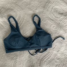 This Bikini Top Is In Great Condition And Was Never Worn. It Comes With Pads And Can Be Removed. The Straps Are Not Functional, However It Has A Functional Tie In The Back. Beach Low-cut Bra With Adjustable Straps, Low-cut Bra With Adjustable Straps For Beach, Adjustable Low-cut Bra For Beach, Blue Low-cut Swimwear For The Beach, Blue Low-cut Swimwear For Beach, Low-cut Blue Swimwear For Beach, Blue Beach Bra With Adjustable Straps, Blue Fitted Strappy Swimwear, Blue Fitted Strappy Tankini