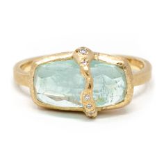 This sumptuously juicy aquamarine ring will have you thirsting for more. Diamonds flowing down the face of this imperfectly perfect pop of color. Celebrating our imperfections empowers us to see the true beauty that resides in us. Forged by our strengths and weaknesses, virtues and vulnerabilities, you are beautifully unique. A one of a kind just like this collection. Pictured in:14k yellow gold1.35ct Aquamarine.04ctw full cut white diamonds Luxury Gemstone Rings In Recycled Gold, Rings By June, Tourmaline And Diamond Ring, Baguette Aquamarine Ring, Unique Stone Setting, Aquamarine And Diamond Ring, Sapphire Baguette Ring, Sea Inspired Jewelry, Colorful Rings