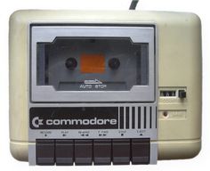 a close up of an old fashioned tape recorder with the word commandore on it