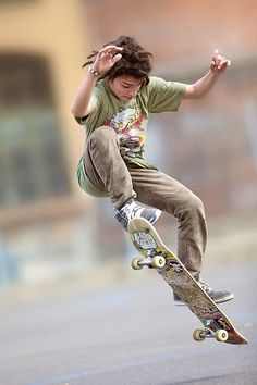 a man flying through the air while riding a skateboard