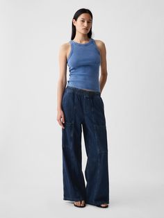 Fit: A full-length high rise jean that's loose throughout.  Finishes with a relaxed wide leg.  Fabric: 95% Cotton, 5% Recycled Cotton.  Stretch: No Stretch Jeans.  Authentic denim that gets better with every wear.  Made to wear all day & break in over time. ​ Rise: High Rise Skirt.  Look: A loose wide-leg utility jean in a dark indigo wash.  Details: Elasticized waist, front slant pockets, side cargo pockets, & back patch pockets.  Responsibly Made: This pair of jeans is part of our water-saving High Rise Skirt, Streetwear Accessories, Loose Fit Jeans, Break In, Gap Jeans, Denim Outfit, Stretch Jeans, Recycled Cotton, Daily Fashion