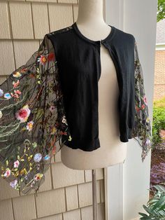 Ooak size medium black embellished cropped cardigan Size 8-10 Full refund if not satisfied Elegant Embroidered Spring Cardigan, Fitted Shrug With Lace Sleeves For Spring, Chic Long Sleeve Cardigan For Festival, Long Sleeve Summer Shrug For Party, Spring Bohemian Embroidered Cardigan, Fitted Bohemian Cardigan With Floral Embroidery, Chic One-size Spring Cardigan, Fitted Bohemian Embroidered Cardigan, Chic Shrug For Spring Layering