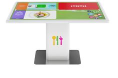 a white table with a colorful menu on it