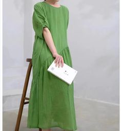 Made from high-quality ramie, this dress is breathable and comfortable for summer. The unique asymmetric design adds an artistic flair to your wardrobe. Loose fit for a relaxed and casual look, perfect for everyday wear. Available in a fresh green color that adds vibrancy to any outfit. Material:washe soft Linen 150g/m Mid-wightwe custom made any size.Here is the size chart for your kind conference: S: Size: Bust:104cm/40.9" length 118cm/47.2" M: Size: Bust:108cm/42.5" length 118cm/47.2" L: Size: Bust:114cm/44.8" length 118cm/47.2" XL: Size: Bust:120cm/47.2"" length 118cm/46.5" Measuring Method: Click to view the measurement method Shipping: we ship worldwide the USPS takes about 10-15 days if you want a express shipping,please contact with us Payment: we accept payment by PayPal and credi Casual Linen Dress With Asymmetrical Hem, Casual Green Midi Dress With Asymmetrical Hem, Green Casual Maxi Linen Dress, Casual Green Maxi Linen Dress, Casual Green Linen Maxi Dress, Linen Dress Summer, Shirt Blouses Women's, Wool Coat Women, Summer Linen Dresses