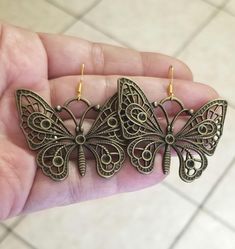 New  Handmade  Large Butterfly Earrings  These bohemian beauties are sure to make your heart flutter!   ♡ Chose from Bronze butterflies with 14k Gold over silver ear hooks (or) Stainless steel butterflies with .925 Sterling Silver ear hooks ♡ Stunning filigree detailed butterfly charms measure 1.5 inches tall x 1.5 inches wide ♡ Dangle length with hook measures 1.75 inches  ♡ Hypoallergenic, nickel free  Ships within 24 hours of cleared payment Monday-Saturday Gift Packaging & Messages: Your ite Bohemian Metal Heart Earrings As Gift, Bohemian Style Heart Earrings As A Gift, Bohemian Nickel Free Heart Earrings, Bohemian Butterfly Earrings For Pierced Ears, Handmade Butterfly Metal Earrings, Butterfly Earrings For Jewelry Making, Handmade Metal Butterfly Earrings, Bohemian Silver Butterfly Earrings, Bohemian Gold Heart Drop Earrings