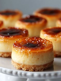 small desserts are arranged on a white plate