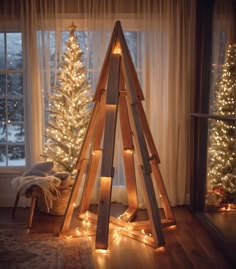 a christmas tree made out of wooden planks in front of a window with lights