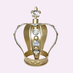 a gold crown with white stones on it