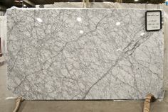 a large white marble slab in a warehouse