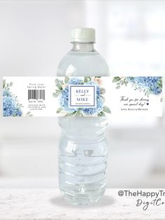 water bottle label with blue hydrangeas and greenery on the side for wedding favors