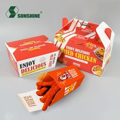 two boxes of chicken sticks sitting next to each other on a gray surface with the box open