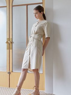 Editor's NotesA Linen blend no-collar shirt dress, featuring lightweight and breezy without compromising on shape.- Made with linen and rayon blend fabric- Mother-of-pearl Button detail- Cool and durable material for summer- Belted style - Out and in-pocketsMeasurements(in.)One size- Total length (Front): 38.97 in.- Total length (Back):39.76 in.- Shoulder: 15.35 in.- Chest: 18.89 in.- Sleeve: 11 in.*Model info: Height: 5'6'' / Bust: 32 in. / Waist: 24 in. / Hip: 34 in.*Depending on measurem Casual Beige Shirt Dress For Spring, Spring Beige Shirt Dress With Placket, Elegant Beige Linen Workwear Dress, Beige Cotton Shirt Dress For Daywear, Beige Shirt Dress With Placket For Daywear, Beige Shirt Dress For Daywear, Summer Relaxed Fit Shirt Dress For Work, Elegant Relaxed Fit Linen Workwear Dress, Elegant Relaxed Fit Linen Dress For Work