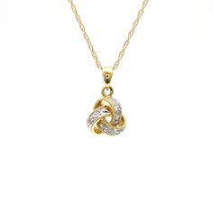 14 Karat Gold Love Knot Pendant Necklace Featuring 0.06 Carat Total Weight Round Diamonds of I1 Clarity and H/I Color. 16 Inches Long. Style KNOT. Available in white or yellow gold. Diamond Knot Necklace, Diamond Knot, White Gold Chains, Love Knot, Knot Necklace, Long Style, Pave Diamonds, Diamond Pendant, Round Diamonds