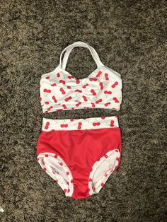 a red and white bathing suit with hearts on it