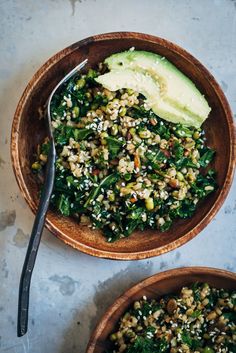 two wooden bowls filled with green vegetables and rice