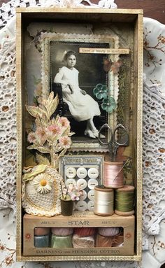 an altered photograph with spools of thread and flowers on a lace doily