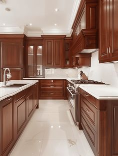 a large kitchen with wooden cabinets and white counter tops, along with marble flooring