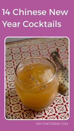 a glass filled with orange juice on top of a table