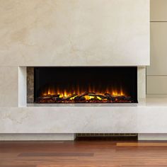 an electric fireplace in a living room with wood flooring and white marble wall covering