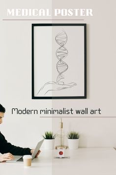 a man sitting at a desk with a laptop computer in front of him and the words modern minimalist wall art