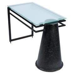 a table with a glass top and black metal frame on an isolated white background for display