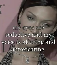 a woman with an interesting message on her face that says, my eyes are seductive and my voice is alluring and intoxigating