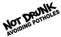 the words not drunk avoiding potholes are black and white on a white background,