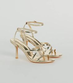 Keep a stylish step ahead of the crowd in these metallic stiletto heels! Perfect for semi-formal events and cocktail parties, these fashion heels make a bold statement everywhere you go. Featuring a sleek almond toe and a strappy design, a short stiletto heel, and an adjustable ankle strap with buckle closure to secure the style. Complete the look in a satin midi dress and clutch! 
 Fit & Features 
 
 3.5" Short stiletto heel 
 Almond toe 
 Strappy design 
 Adjustable ankle strap, buckle closure 
 Cushioned footbed 
 Faux leather metallic material 
 Runs true to size 
 Selected fashion products to make you show your confidence and charm Bridesmaids Heels, Short Stiletto, Black Bridesmaids, Sequin Bridesmaid Dresses, Red Bridesmaids, Cocktail Outfit, Purple Bridesmaid Dresses, Red Bridesmaid Dresses, Black Bridesmaid Dresses