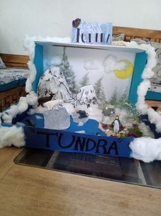 there is an image of tundra in the clouds on this cardboard box that was made to look like it's floating