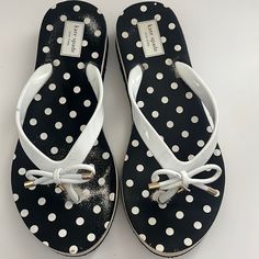 Kate Spade Black/White Sandals Size 9m Kate Spade Synthetic Sandals For Vacation, Kate Spade White Sandals With Round Toe, Kate Spade White Round Toe Sandals, Kate Spade Synthetic Sandals For The Beach, White Kate Spade Sandals For Summer, Kate Spade Summer Sandals With Round Toe, Kate Spade Black Sandals For Spring, White Flip Flops With Branded Insole For Spring, Kate Spade Sandals