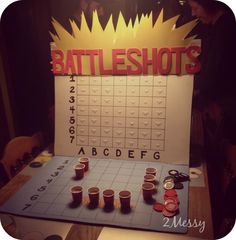 a game board with cups on it that says battleshots