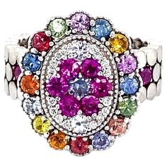 For Sale on 1stDibs - Super gorgeous and uniquely designed 2.41 Carat Multi Sapphire 14 Karat White Gold Cocktail Ring! This ring has a cluster of 31 Round Cut Natural Multi-Colored Oval Multicolor Multi-stone Rings, Dazzling Oval Multi-stone Cluster Ring, Oval Multicolor Cluster Ring Fine Jewelry, Multicolor Oval Diamond Ring For Anniversary, Luxury Multicolor Rings With Center Stone, Multicolor Oval Multi-stone Cluster Ring, Multicolor Oval Halo Setting Jewelry, Oval Multicolor Jewelry With Halo Setting, Multicolor Oval Jewelry With Halo Setting