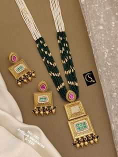 Description :- Necklace /Indian Necklace Set/ Indian Choker Necklace/ Pearl Necklace /Guttapusalu necklace /Temple jewelry/ South Indian jewelry Gift yourself a royal look with this perfectly crafted kundan necklace set from Manalisstudio. Crafted with high quality kundan stones and pearls, it is impressive in design. The green enamel artwork adds perfect texture to the design. Perfect for weddings and festivities, this antique necklace set should be put on with your favorite sari or lehenga. 10 Luxury Hallmarked Temple Necklace For Festivities, Fusion Style Ceremonial Bridal Necklace With Meenakari, Fusion Style Bridal Necklace With Meenakari For Ceremonies, Fusion Style Meenakari Bridal Necklace For Ceremonies, Elegant Multicolor Temple Necklace For Celebration, Fusion Style Bridal Necklace With Cutdana For Ceremonial Occasions, Elegant Beaded Kundan Necklace For Ceremonial Occasions, Elegant Multicolor Temple Necklace As Gift, Elegant Pearl Necklace With Meenakari For Gift