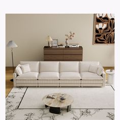 a living room filled with furniture and a white rug