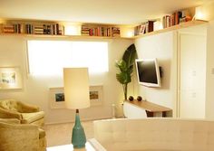 a living room filled with furniture and a flat screen tv