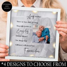 a woman holding up a framed photo with the words, 4 designs to choose from