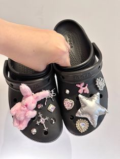 Pink and silver croc jibbitz set Bedazzled Crocs Shoes Pink, Croc Sandals With Jibbitz, Cute Crocs Jibbitz Ideas, Jibbitz Bracelet, Black Crocs With Jibbitz, Crocs Jibbitz Aesthetic, Baddie Crocs, Croc Aesthetic, Jibbitz Crocs Ideas