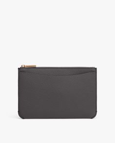 Rectangular zippered clutch bag with textured surface. Chic Bags With Zipper Pouch For On-the-go, Elegant Soft Leather Clutch For On-the-go, Elegant Zipper Pouch Bag For On-the-go, Chic Wallet With Removable Pouch For Everyday Use, Luxury Rectangular Pouch For Everyday, Chic Wallets With Zipper Pouch, Luxury Rectangular Everyday Pouch, Chic Everyday Pouch Wallets, Luxury Pouch With Adjustable Strap For Daily Use