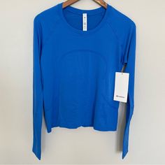 Nwt Lululemon Swiftly Tech Long Sleeve 2.0 *Race Length Pipe Dream Blue Size 8 Lululemon Swiftly Tech Long Sleeve Blue, Long Sleeve Lululemon Top, Lulu Long Sleeve Shirt, Blue Athleisure Activewear With Thumbholes, Lulu Lemon Tops, Lululemon Colors, Lulu Wishlist, Lululemon Clothes, Lulu Tops