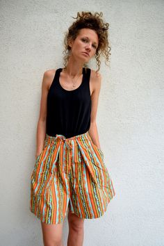 "High waist summer skorts, 60s 70s bohemian shorts, striped hippie shorts, festival wear, M 100% cotton high waist summer skorts. Two side pockets and one more on the bottom. Thick and strong fabric. Size: seems like women's (M) PLEASE CHECK ALL MEASUREMENTS BELLOW: Length: 50cm / 20\" Waist: 70 cm / 28\" Hips: 170 cm / 67\" Inseam: 16 cm / 6\" Fabric: 100% cotton Brand: Mexx Condition: excellent * Wash at temperature not higher than 30oC / 86oF KEEP IN MIND: Photo might be slightly different fr Bohemian Bottoms With Built-in Shorts For Summer, Bohemian Style Short Shorts For Summer, Bohemian Style Summer Shorts, Hippie Beach Shorts For Summer, Striped Cotton Shorts For Summer, Bohemian Striped Bottoms For Vacation, Retro Knee-length Shorts For Summer, Hippie Summer Festival Shorts, Bohemian Summer Festival Shorts