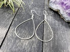 "These super lightweight teardrop hoop earrings feature 40mm x 26mm brass open teardrops. Choose silver-plated or gold-plated! These minimalist geometric earrings will complement any outfit, and are lightweight enough for all day wear! The earrings measure 2.5 inches from the bottom of the teardrop to the top of the ear wires. The gold earrings have hypoallergenic gold-plated surgical steel ear wires, while the silver earrings have hypoallergenic surgical steel ear wires. These earrings are incr Teardrop Hoop Earrings For Everyday, Everyday Metal Teardrop Earrings, Hypoallergenic Metal Teardrop Earrings For Everyday, Everyday Metal Teardrop Drop Earrings, Everyday Teardrop Earrings With Ear Wire, Everyday Teardrop Hoop Earrings, Minimalist Nickel-free Teardrop Earrings, Hypoallergenic Teardrop Earrings For Everyday, Nickel-free Teardrop Earrings For Everyday Wear