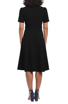 Exude polished style in this short-sleeve fit-and-flare midi dress fashioned with gently puffed shoulders and gleaming tabs at the waist. 43 1/2" length Back zip closure Jewel neck Short sleeves Partially lined 96% polyester, 4% spandex Dry clean or machine wash, dry flat Imported Model stats: 5'10" height, 32" bust, 25" waist, 36" hip. Model is wearing size 4. Formal Midi Dress With Fitted Waist And A-line Shape, Short Sleeve Midi Dress With Flattering Silhouette For Evening, Midi Dress With Flattering Silhouette For Evening, Evening Midi Dress With Flattering Silhouette And Short Sleeves, Fitted Short Sleeve Dress With Flattering Cut, A-line Midi Dress With Fitted Waist For Evening, Elegant Short Sleeve Mid-length Dress For Spring, Classic Fit And Flare A-line Midi Dress, Elegant Mid-length Short Sleeve Dress For Spring