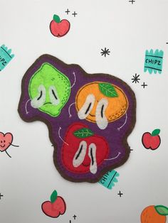 a close up of a patch with fruit on it