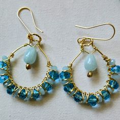 Light Blue And Peacock Blue Crystals Wire Wrapped On Gold Tone Hoops Dangles. Blue Chanceony Teardrops Hang From The Middle. Wire Wrapped Hoop Earrings, Wrapped Hoop Earrings, Wired Jewelry, Earrings Everyday, Artisan Earrings, Wire Work Jewelry, Jewelry Blue, Work Jewelry, Earrings Crystal